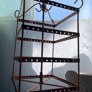 Beautiful bronze piece with places to hold necklaces and earrings